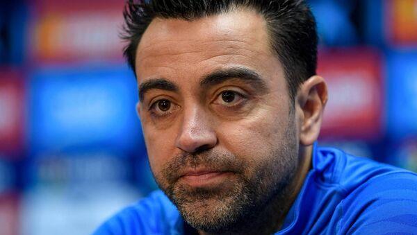 Xavi addresses the press.
