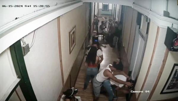 Surveillance videos showing a mob of migrants in the Gateway hotel in El Paso.